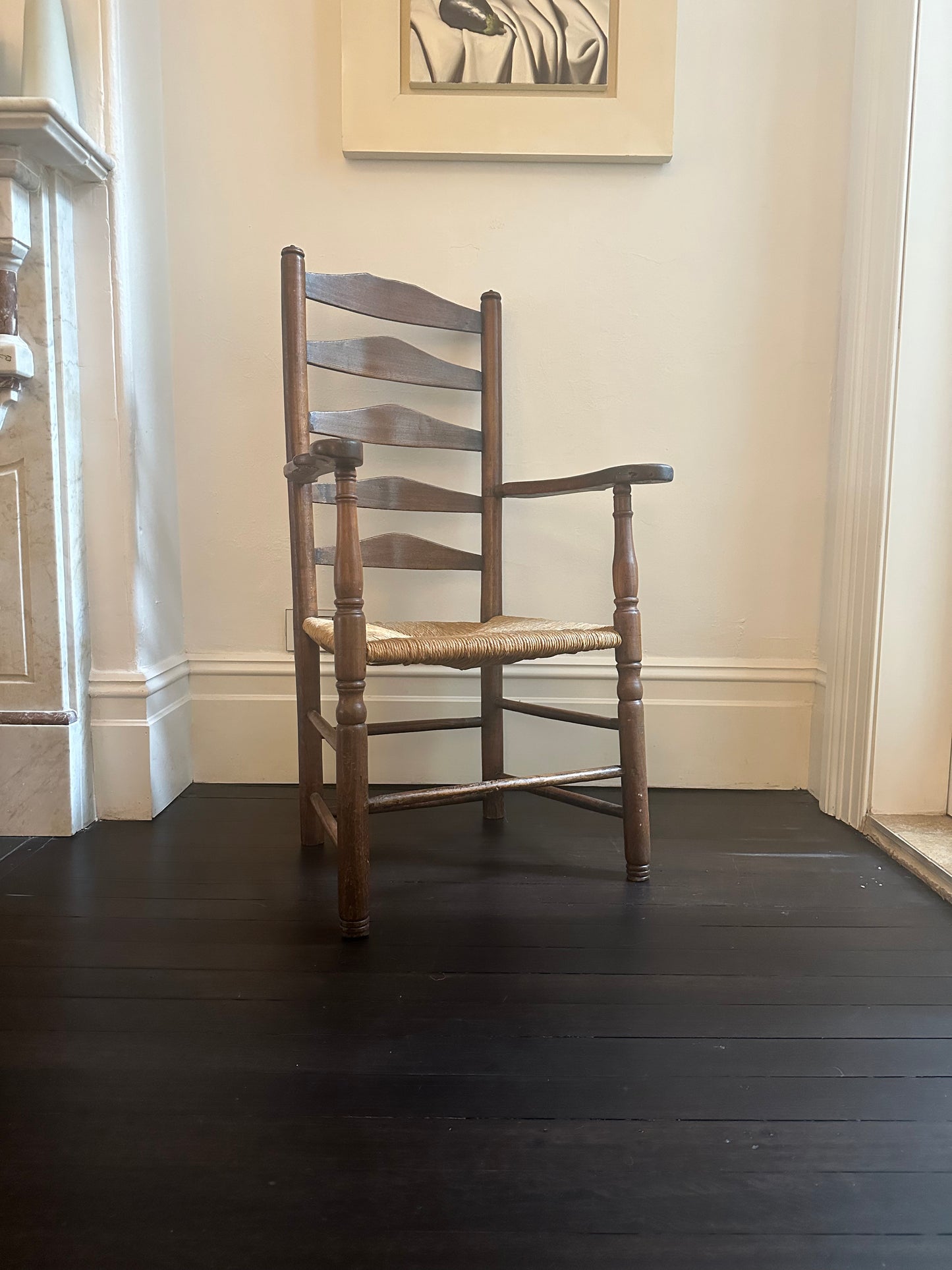 Ladder back chair with a rush seat